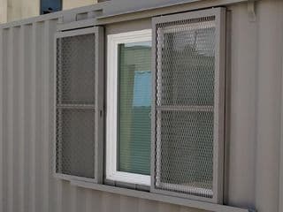 Barn door window security for storage container for sale