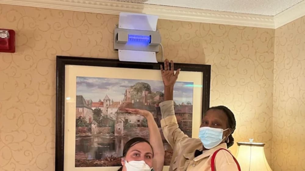 germbuster demo with masked workers
