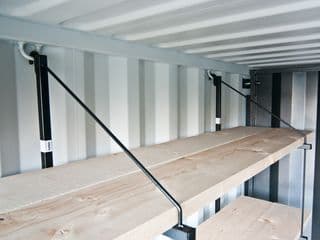 Removable shelving system for shipping container
