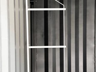 Removable shelving system for shipping container