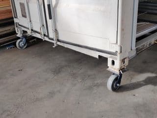 Shipping container caster wheel