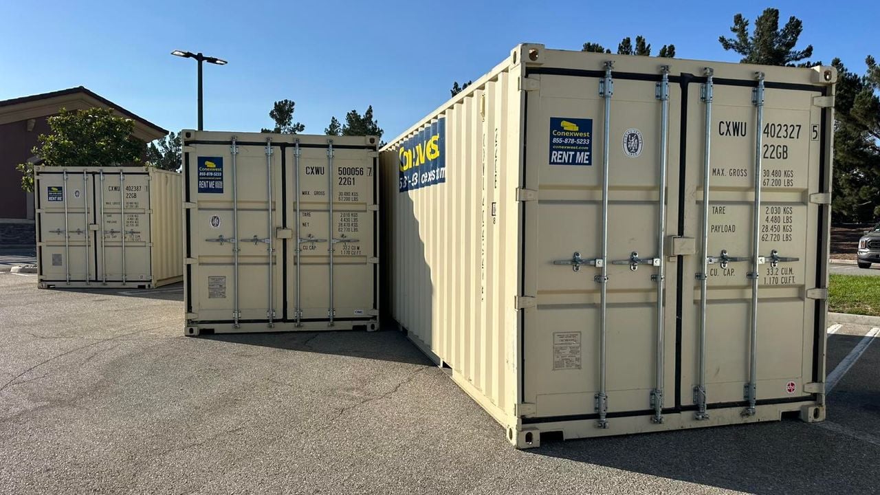Three shipping containers placed outside