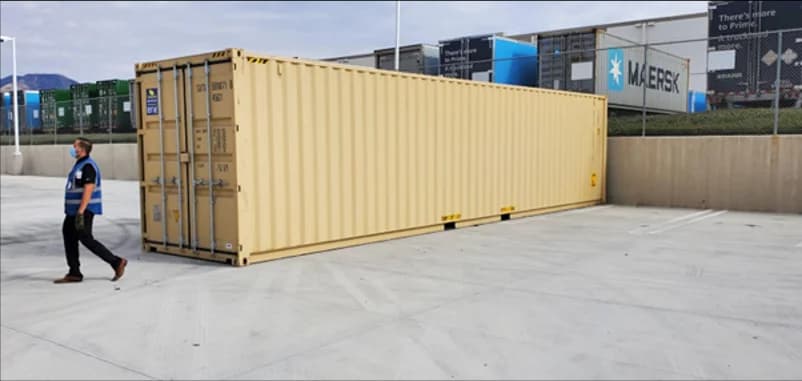A 40-foot storage container on a paved lot