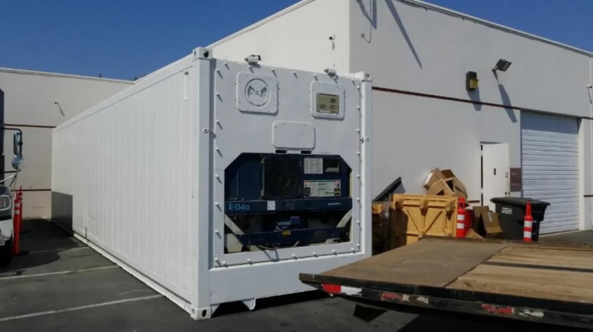 A 40-ft dual voltage refrigerated shipping container painted white.