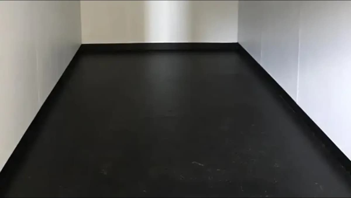 A shipping container with steel flooring