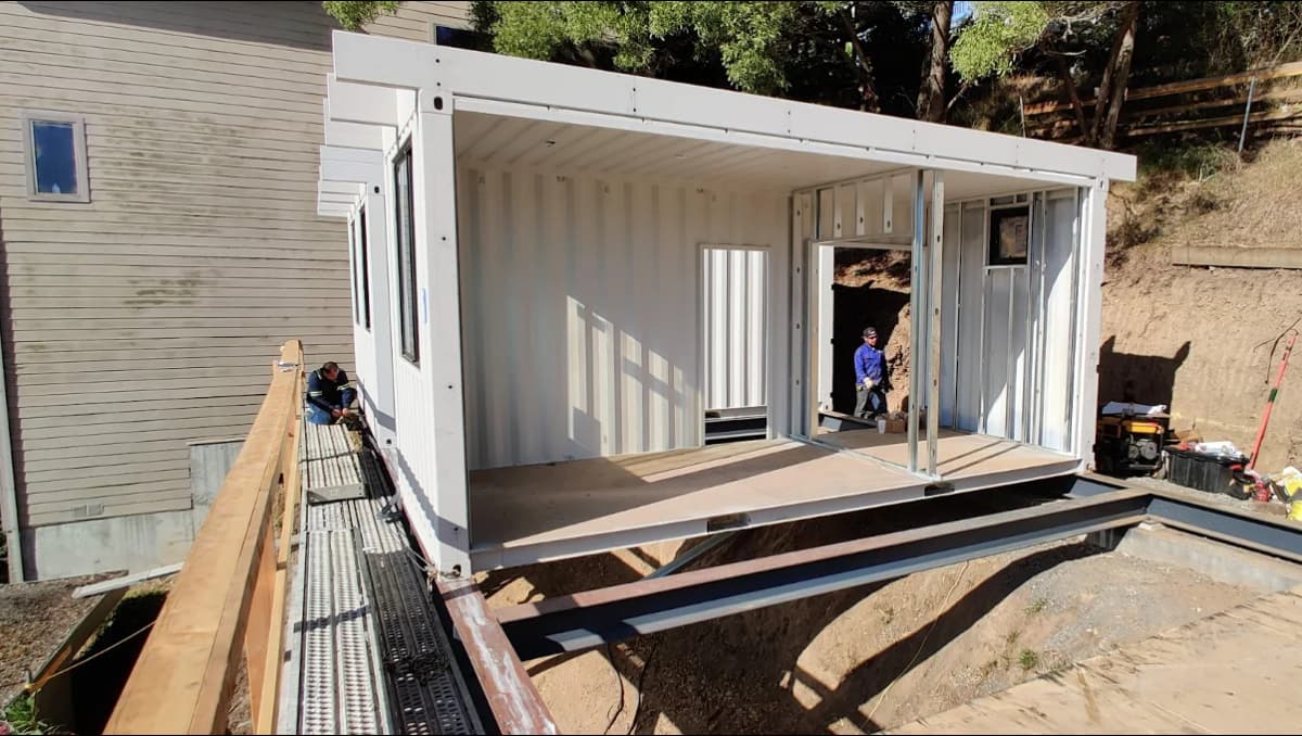 Conexwest team prepping a container home site.