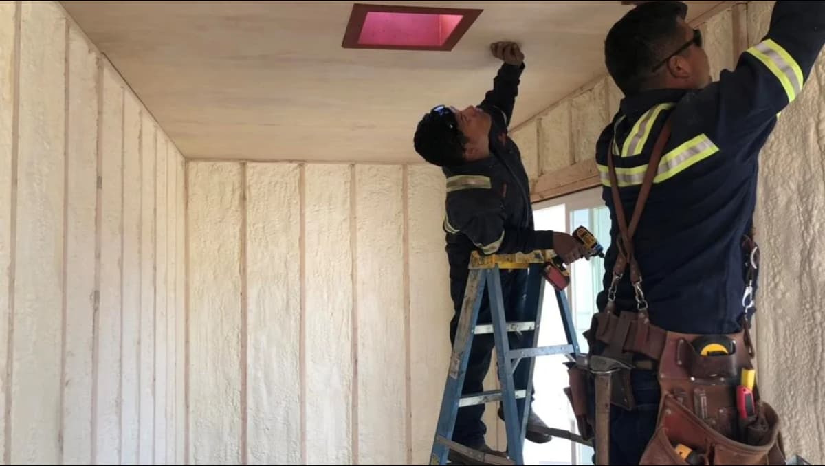 The Conexwest team working on a shipping container home.
