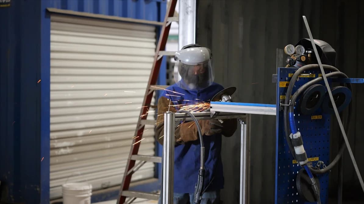 Worker installing roll-up door