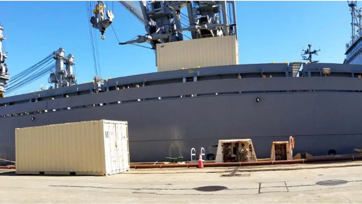 Container structures being moved by installed cranes