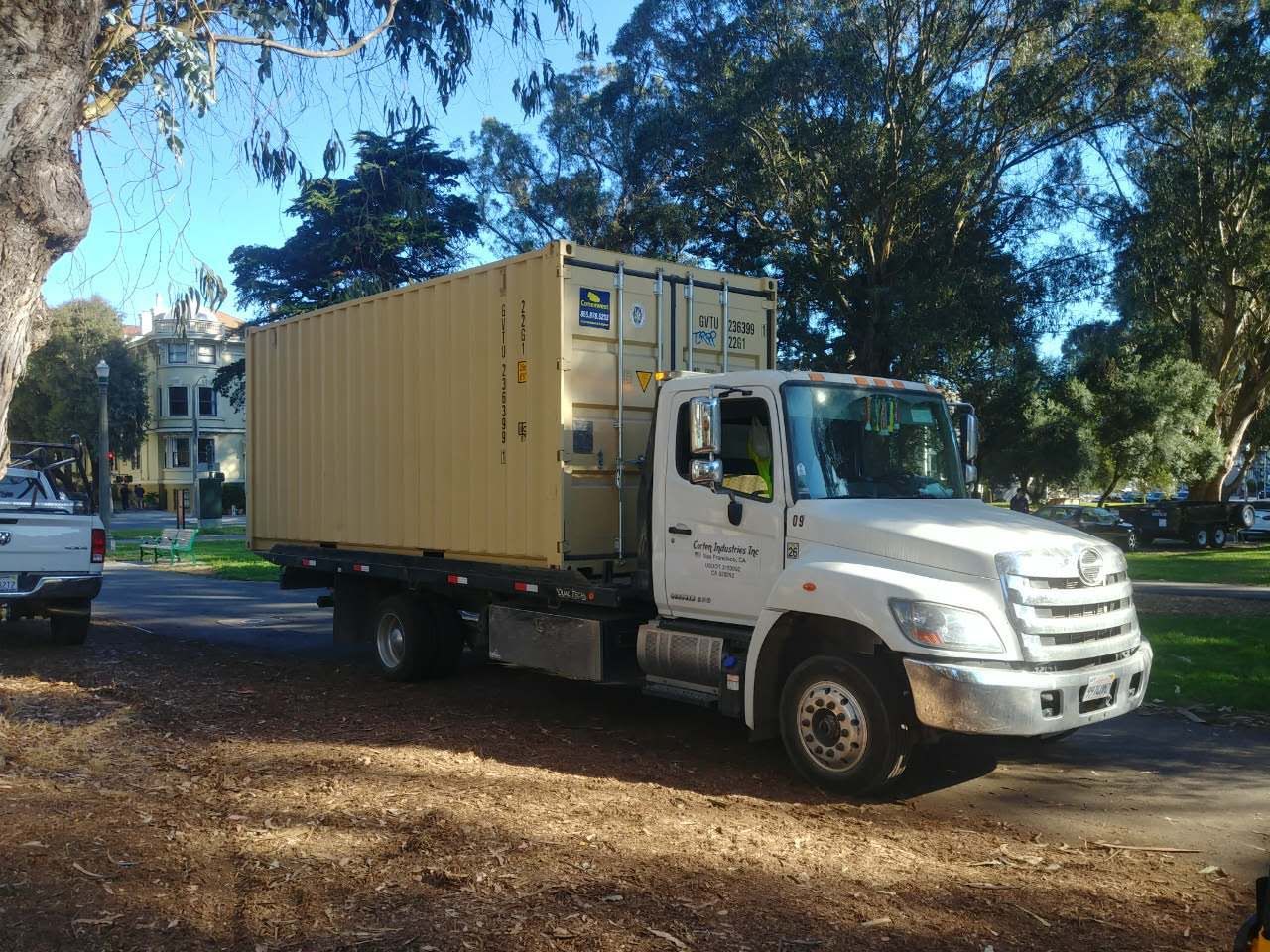 Tilt-bed truck container delivery